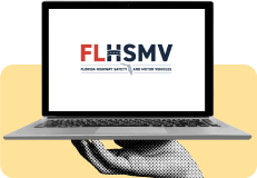 Hand holding laptop with FLHSMV logo