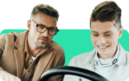 Father teaching son to drive