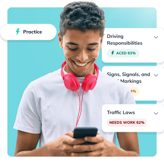 Student taking drivers ed on his phone smiling