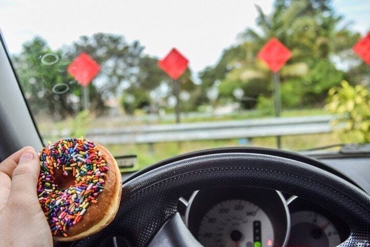 10 Foods You Shouldn't Eat behind the Wheel in Honor of National Donut Day