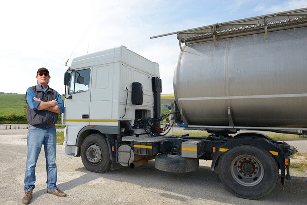 truck driver in front of truck