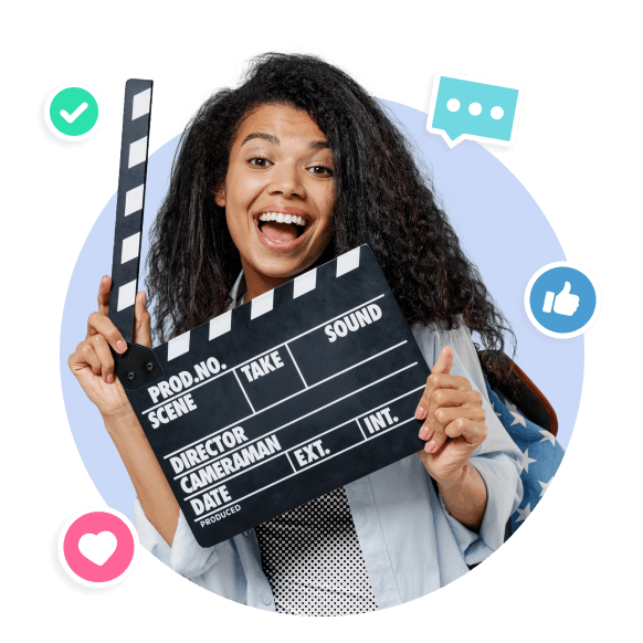 Woman holding a clapperboard