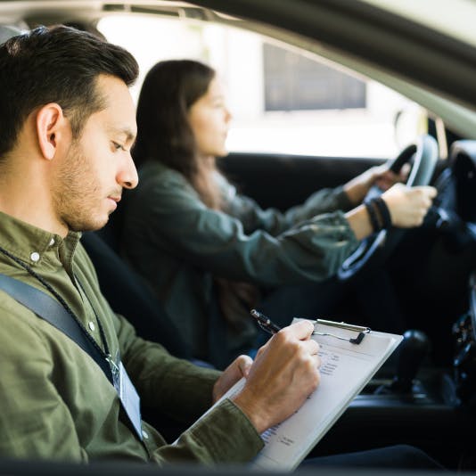 girl taking driving test