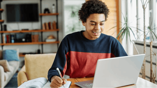 Boy taking online course