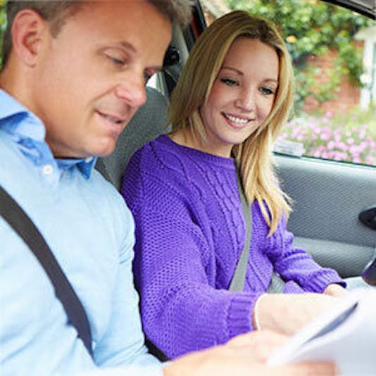 Aceable student getting behind the wheel with a instructor to learn how to drive