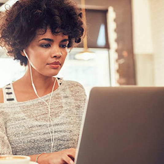 Aceable student using her laptop to take her driving course at home