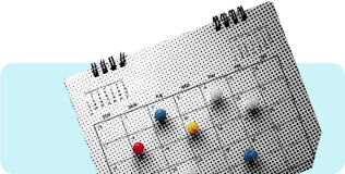 Calendar with push pins in it