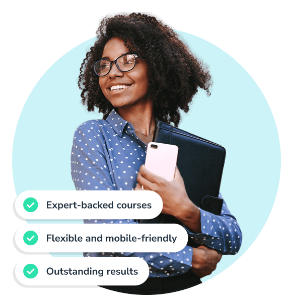 Woman holding cell phone and laptop