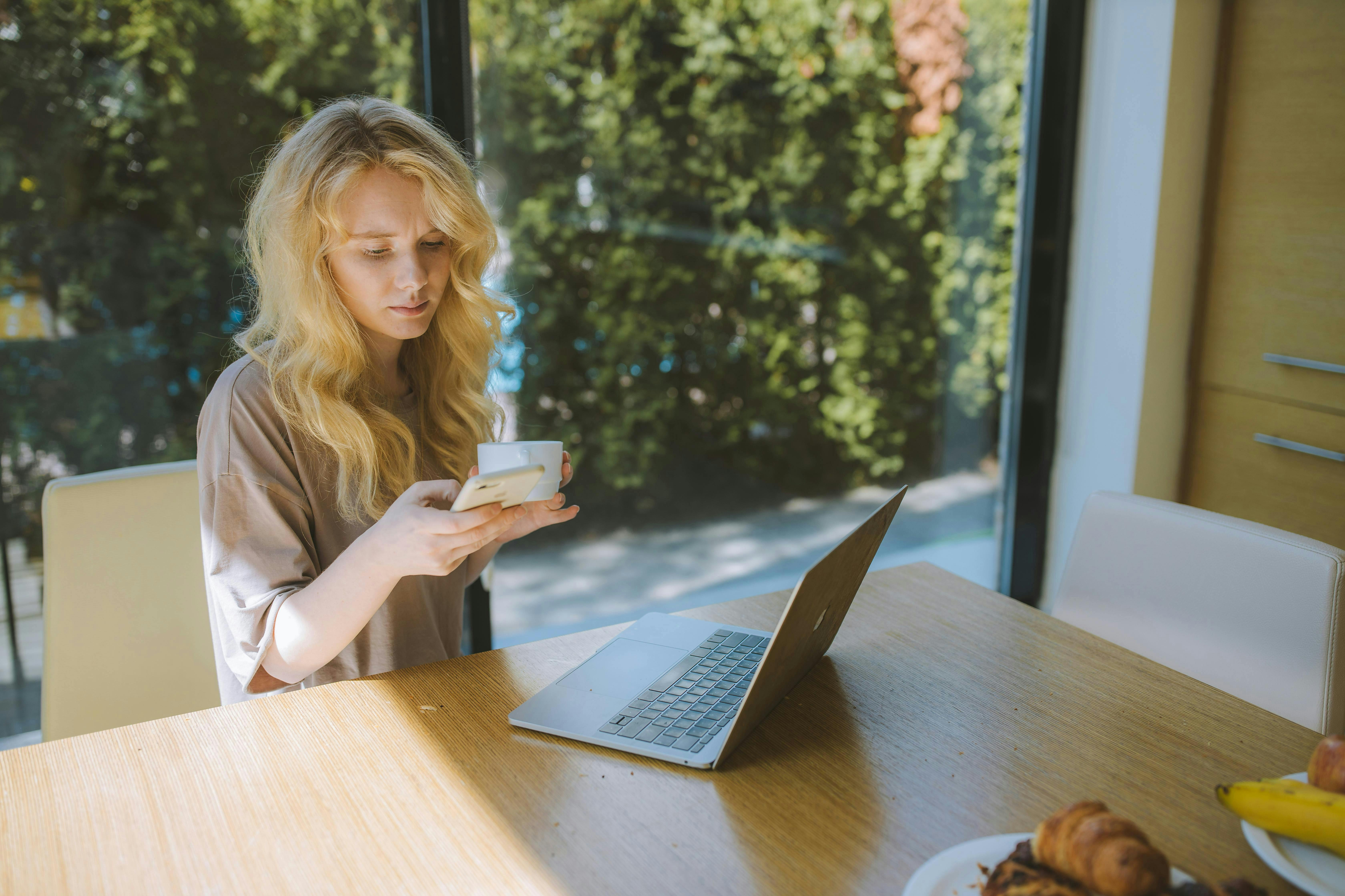 woman on her phone at home