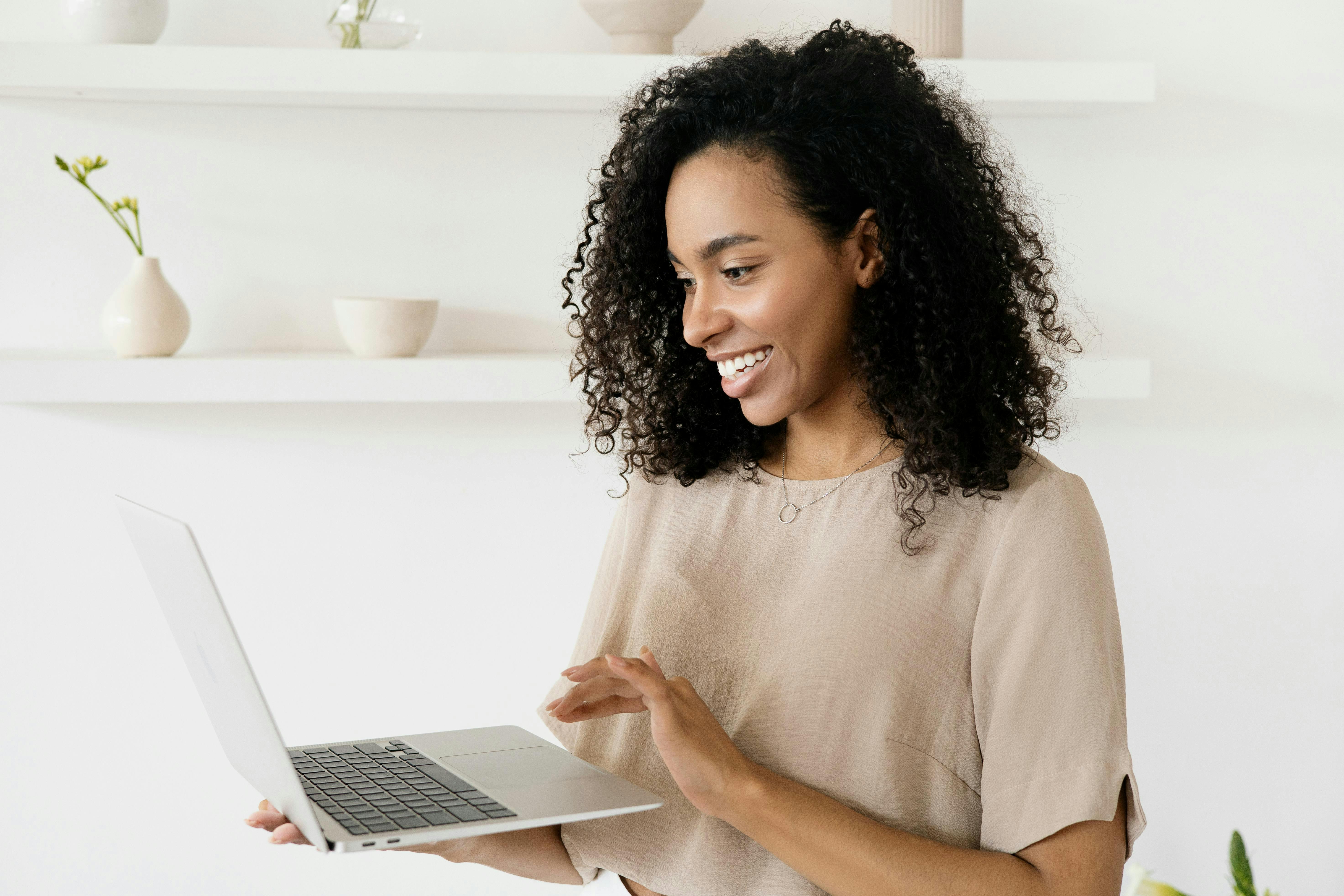 woman on computer smiling