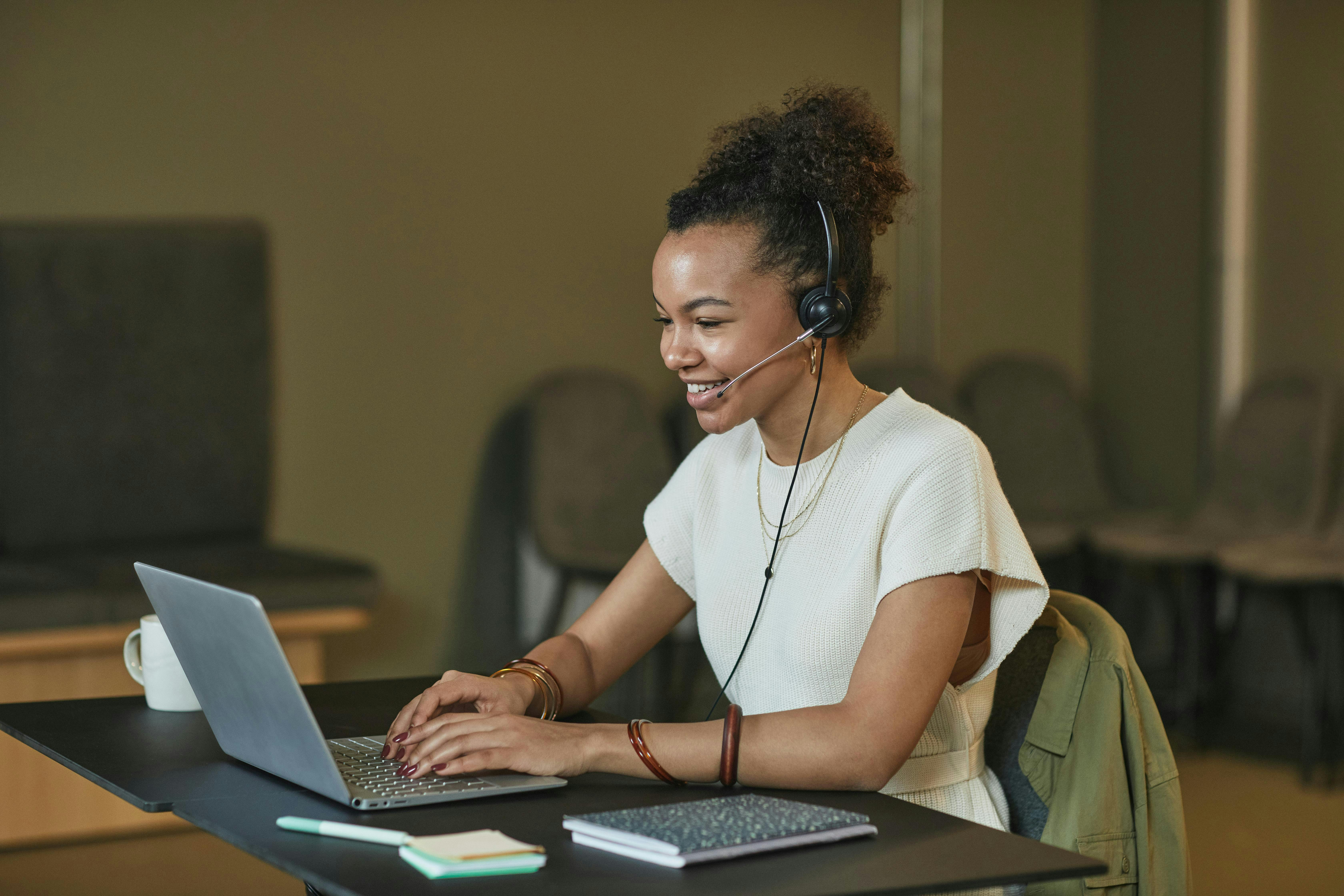 woman on computer smiling