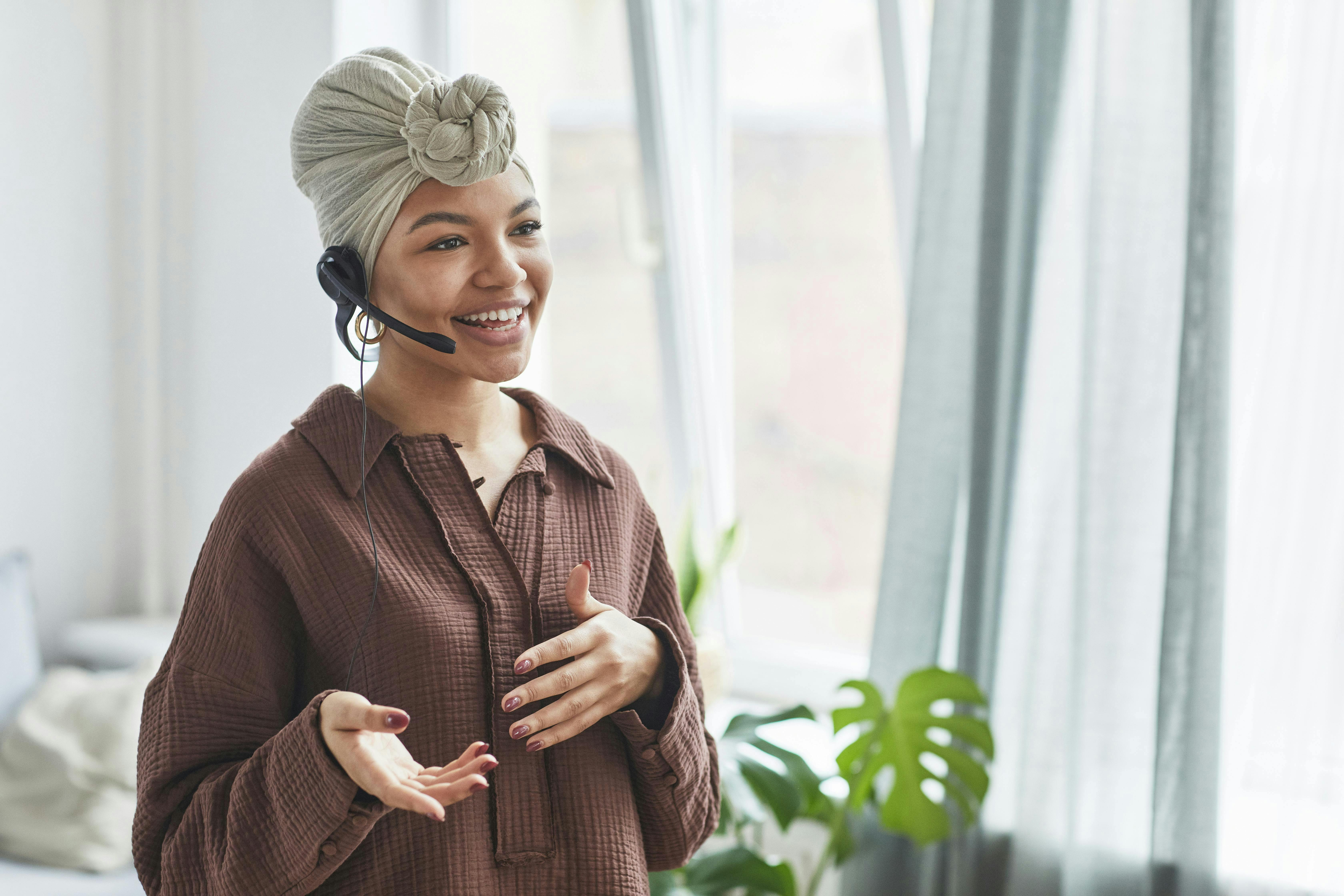 woman smiling talking on a ear device