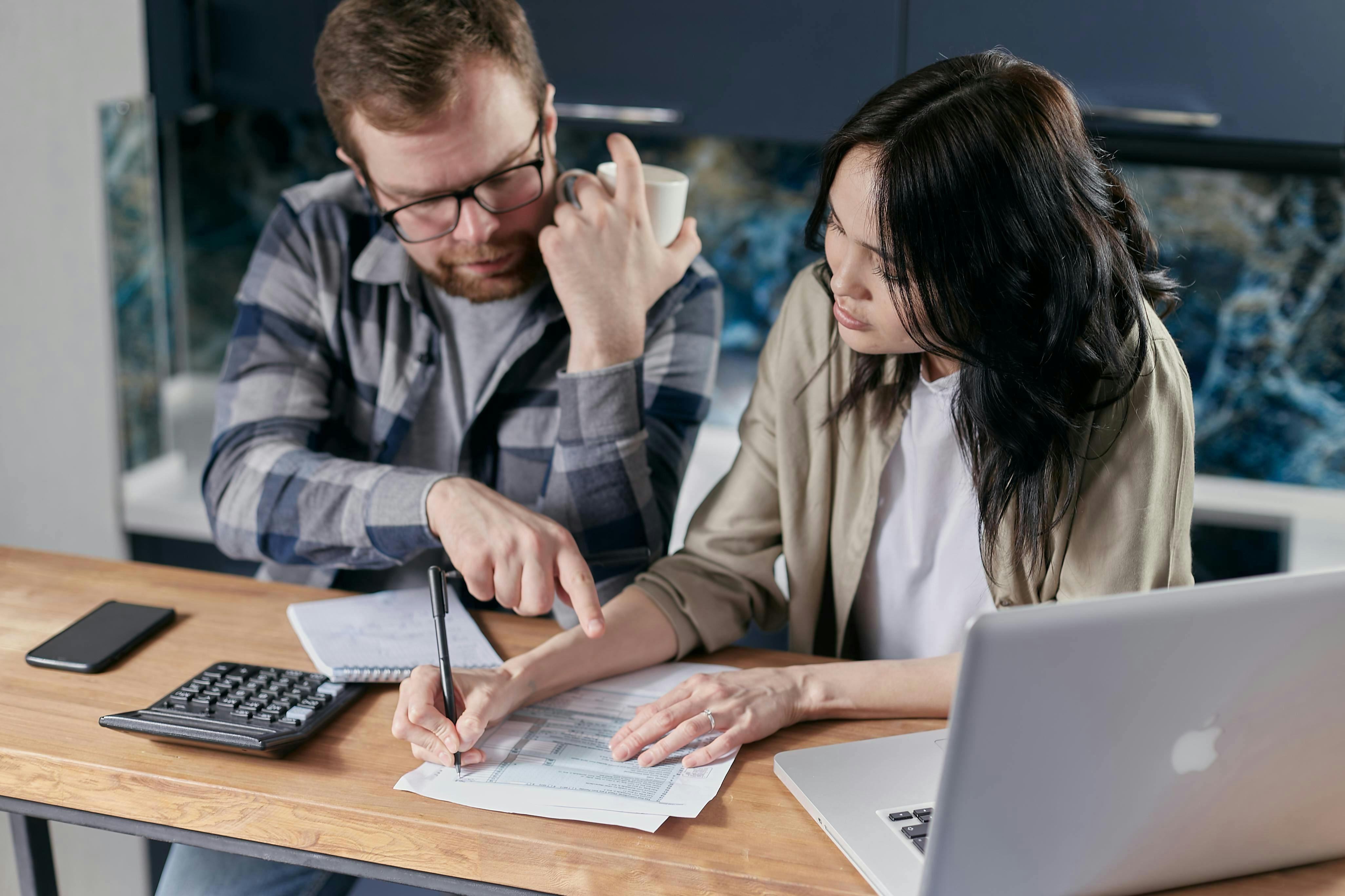 couple using a calculator together