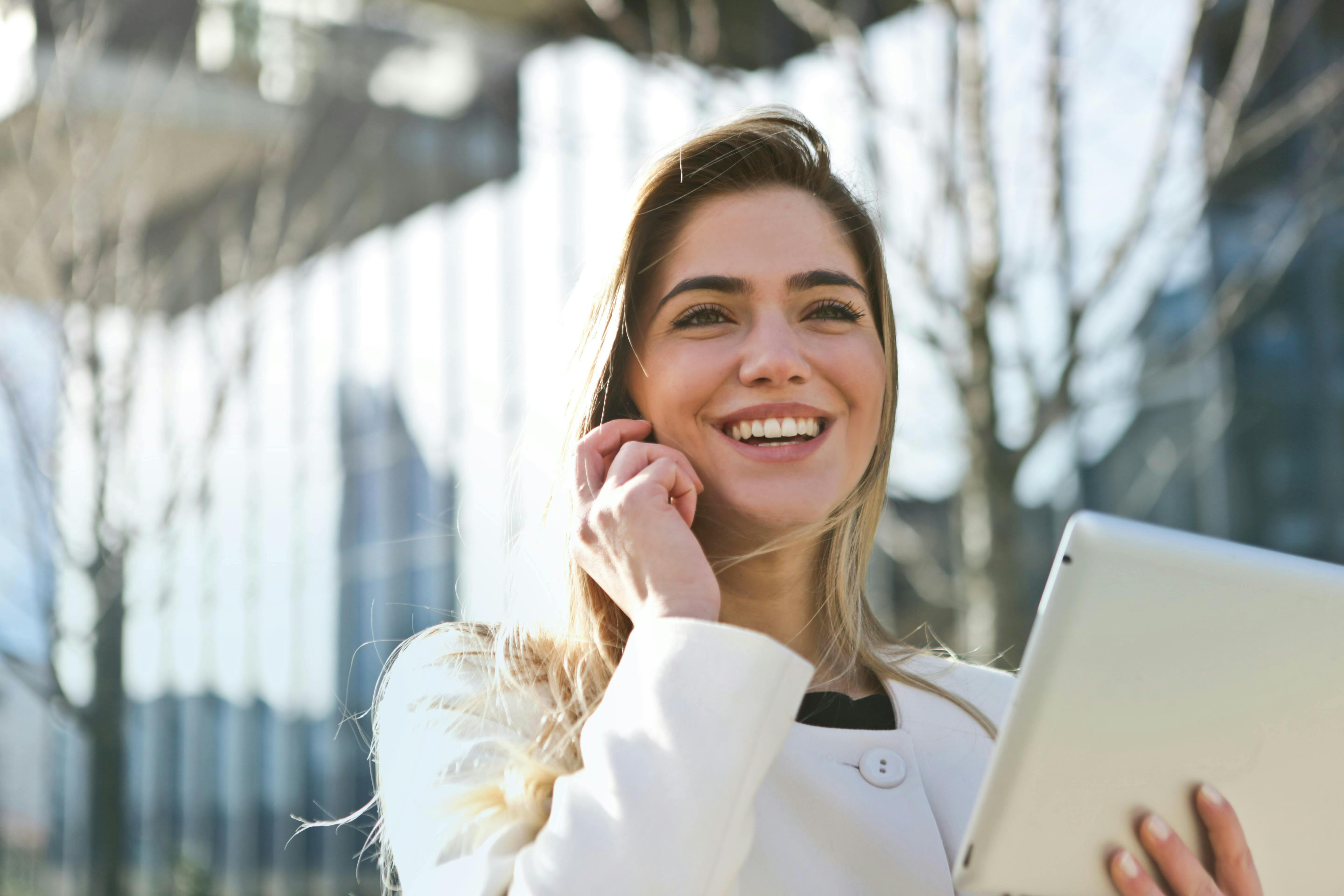 woman on phone smiling