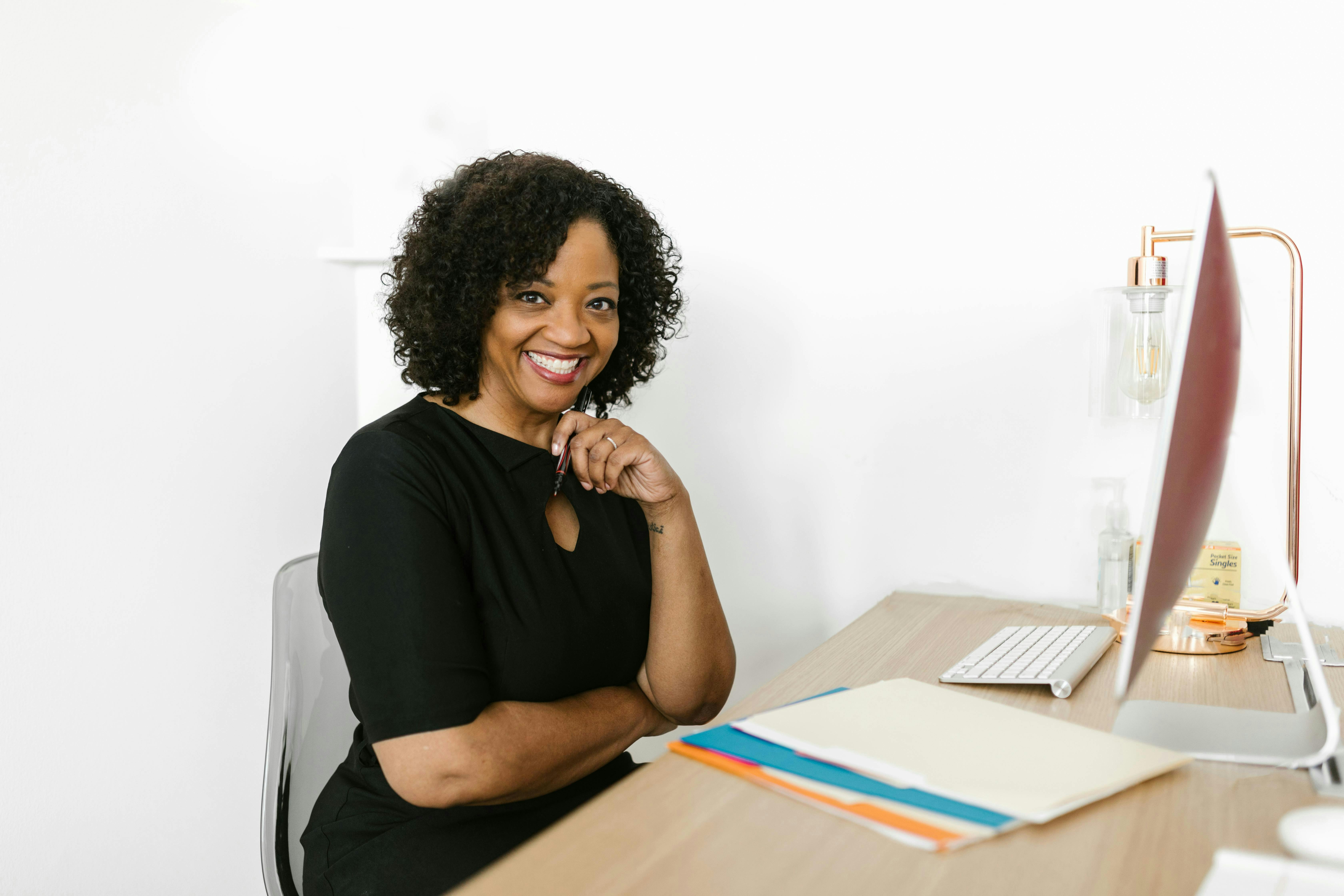 real estate agent on her computer smiling