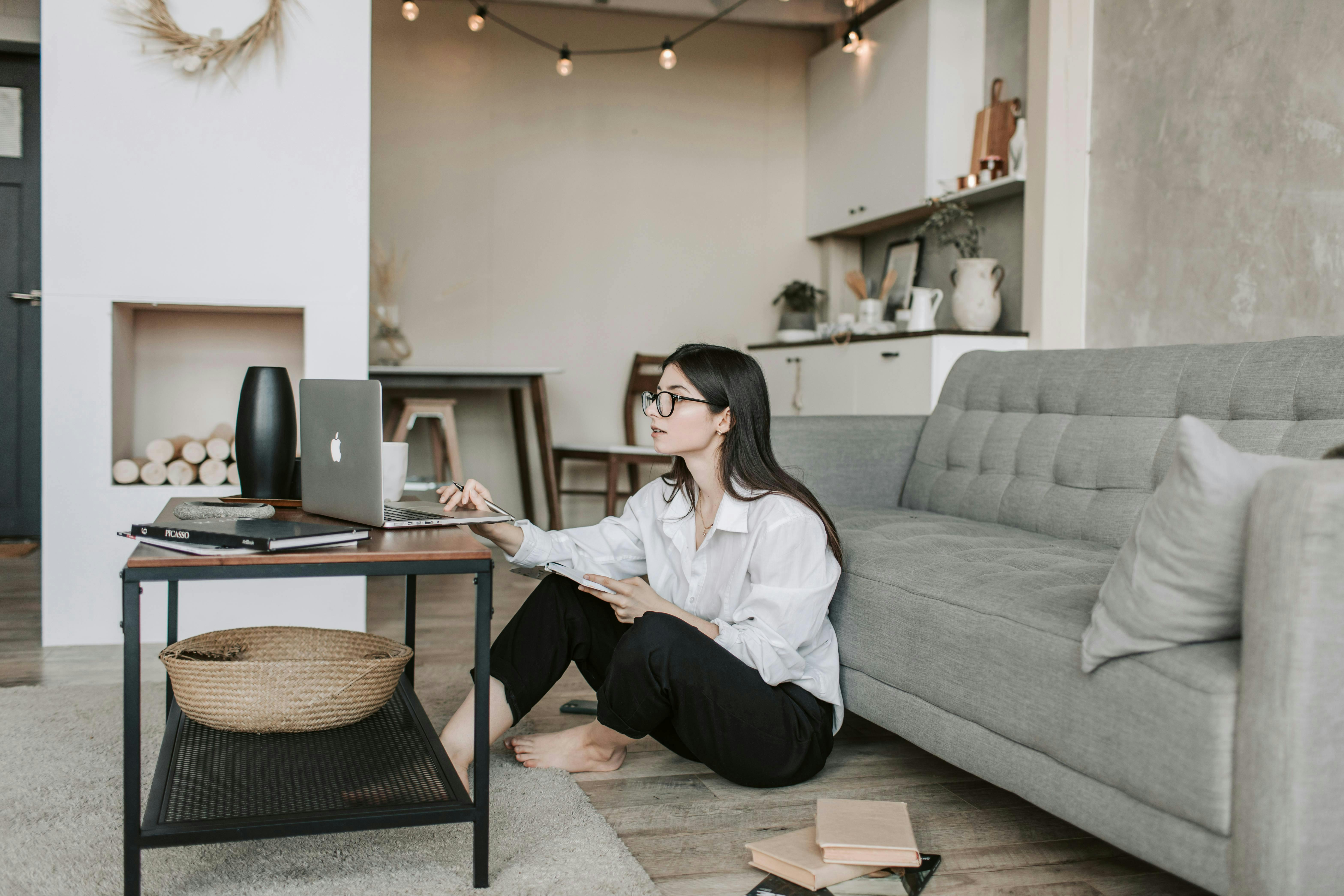 woman at home on her computer in her living room