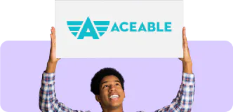 Boy holding an Aceable sign above his head