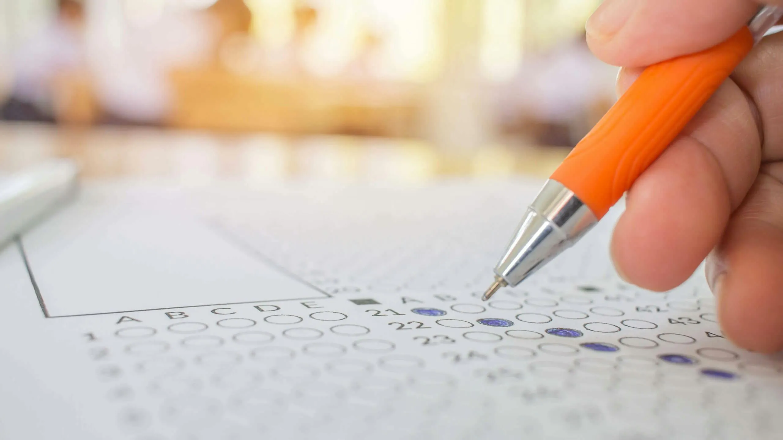 person taking test and bubbling
