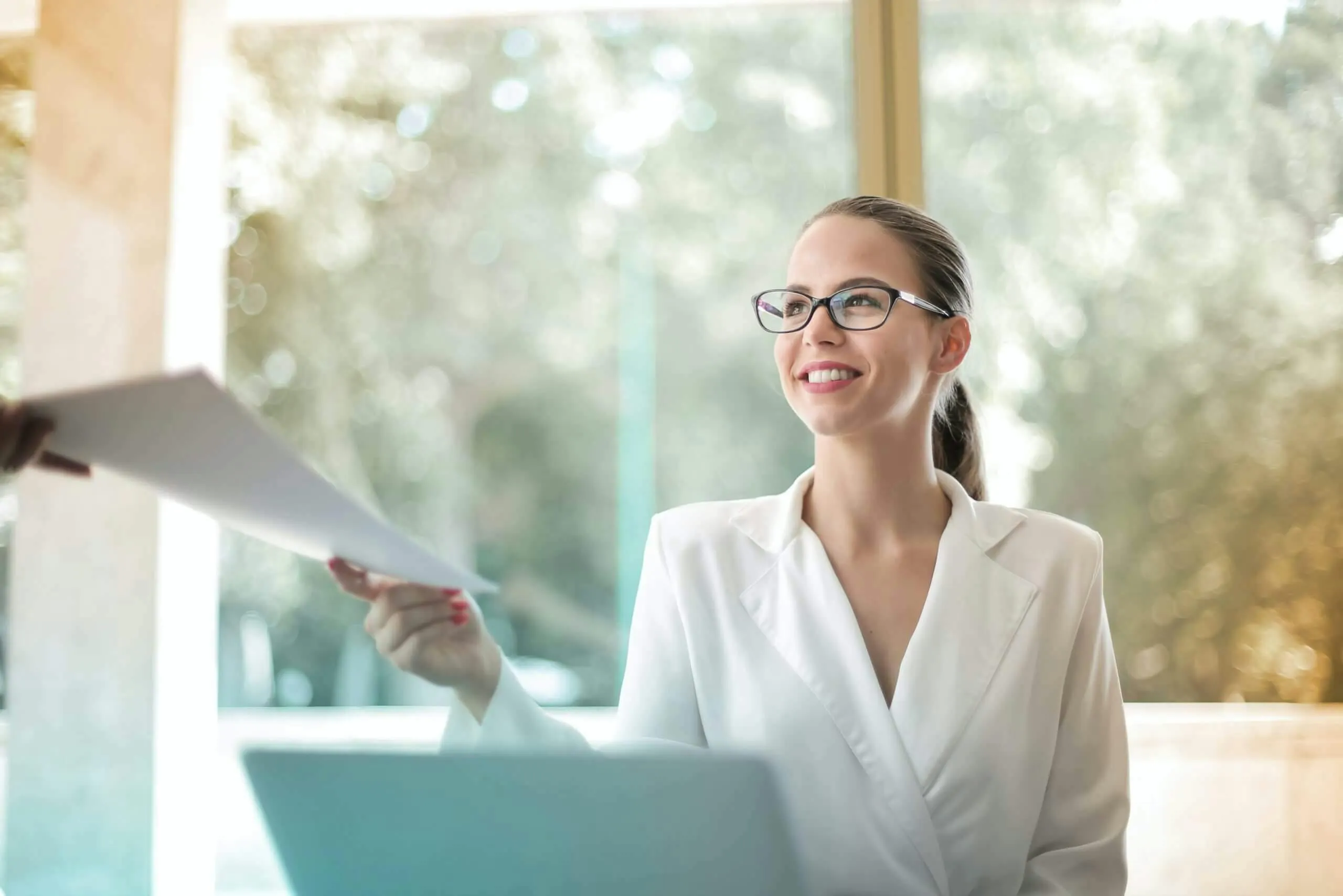 woman passing out paper