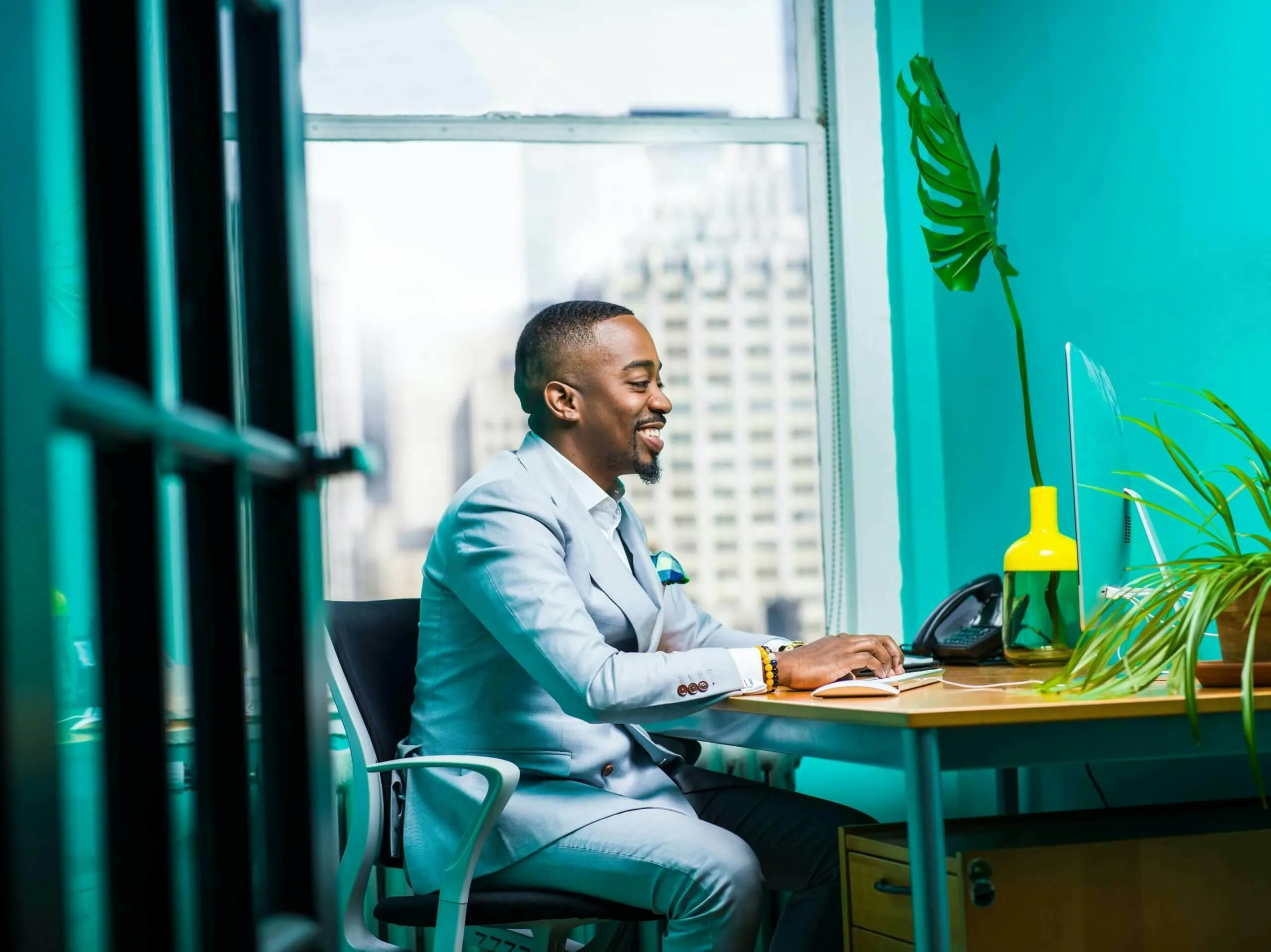 man sitting at desk working