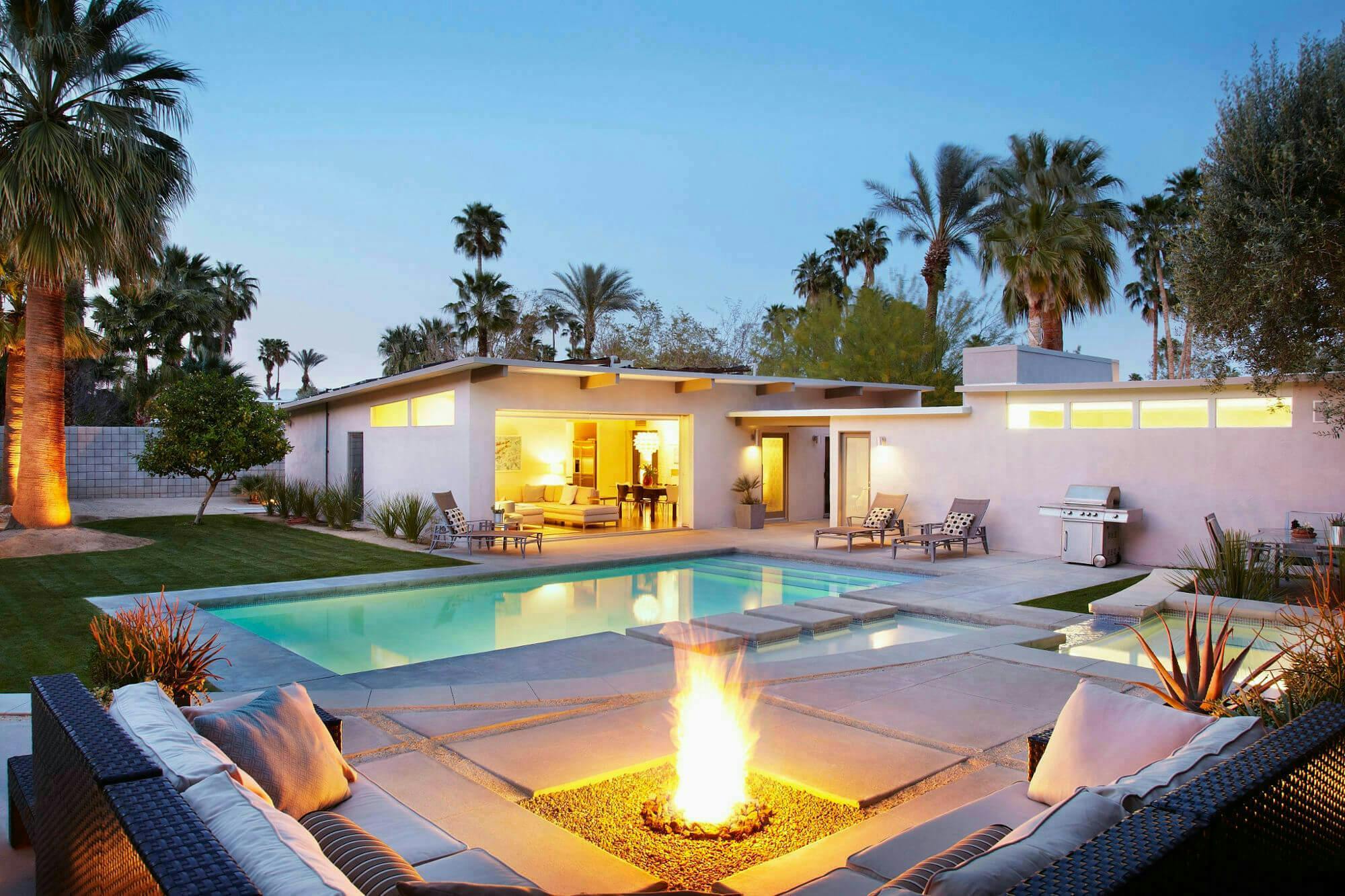 modern home during sunset with heated pool